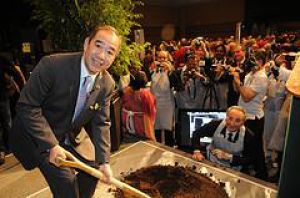 TREES International President Tam plants the first tree
